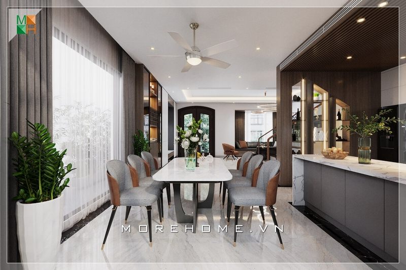 Thiết kế bàn ăn biệt thự hiện đại, chiếc ghế ăn cách điệu với phần thanh mảnh mà không kém phần chắc chắn giúp gia chủ dễ dàng di chuyển hơn trong quá trình dùng bữa